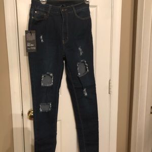 High waisted distressed stretchy denim jeans
